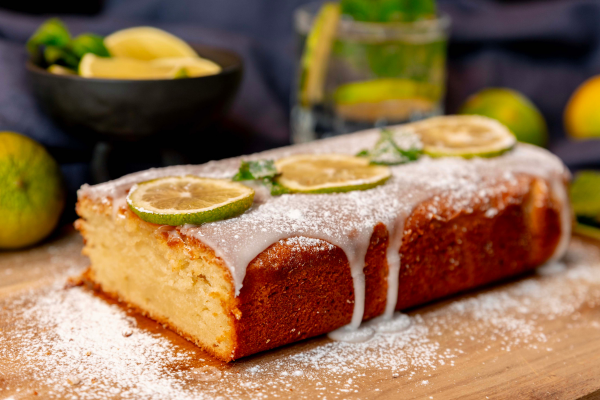 A loaf of bread with lemons on topDescription automatically generated