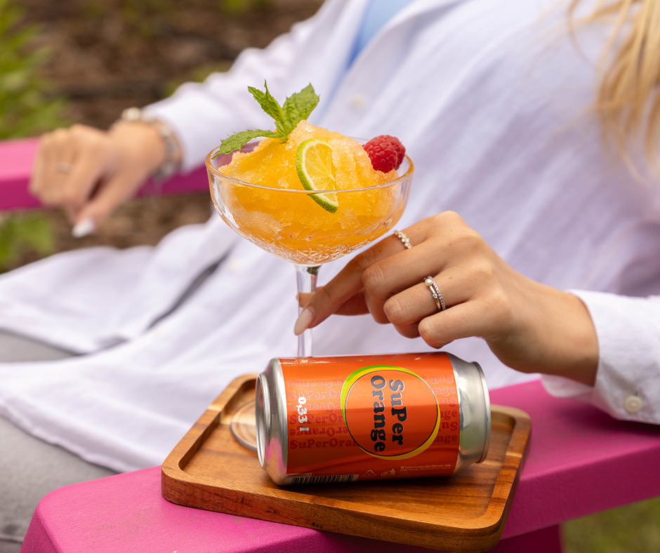 A hand holding a drinkAI-generated content may be incorrect.